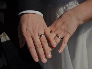 closeup of bride and groom rings