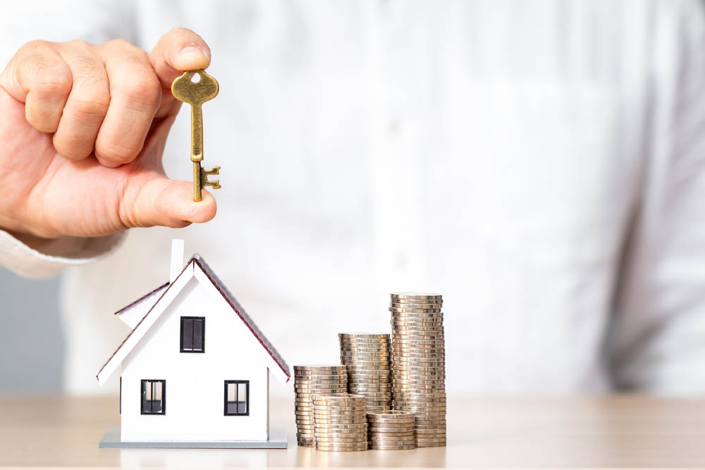stack of coins/bills and house keys into separate piles on a table